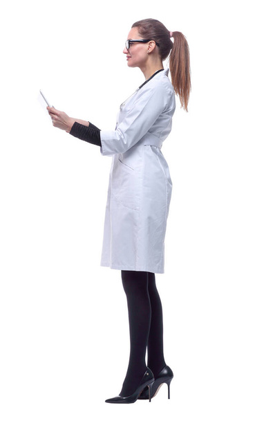 side view. woman doctor looking at the screen of a digital tablet. - Foto, immagini
