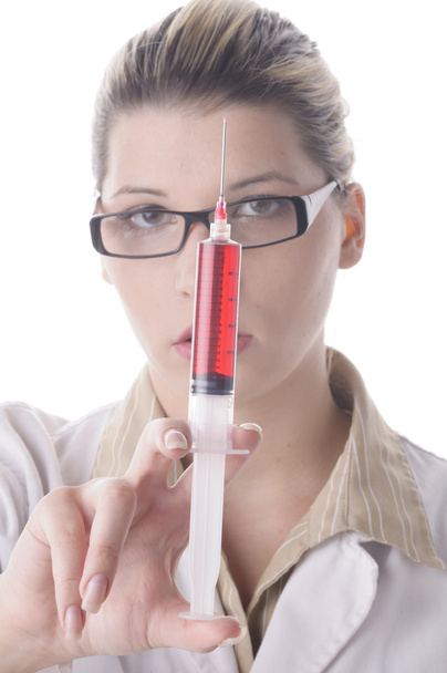 Young female doctor holding a syringe  - Foto, Bild