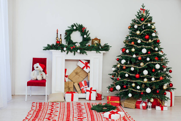 decor fireplace and Christmas tree holiday gifts new year background - Fotoğraf, Görsel
