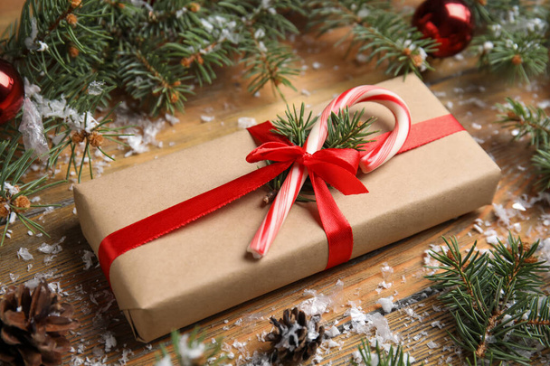 Beautiful gift box and Christmas decor on wooden table - Φωτογραφία, εικόνα