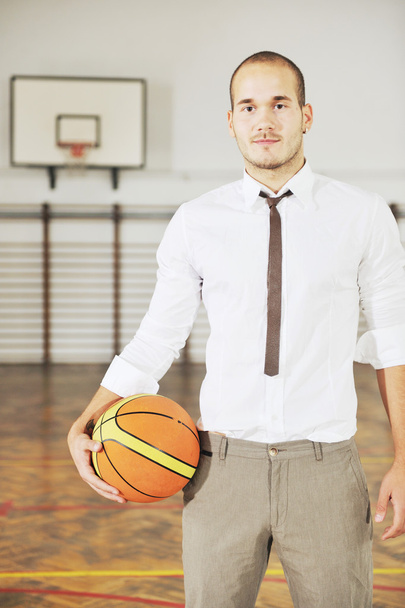 Businessman holding basketball ball - Fotoğraf, Görsel