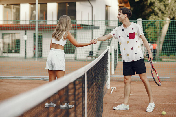  ouple play tennis game outdoor - Фото, изображение