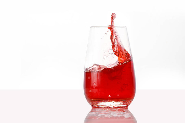Red juice splashes on isolated white background - Foto, Imagem