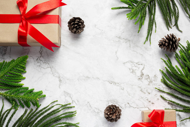a box of present with christmas ornament on marble background - Fotoğraf, Görsel