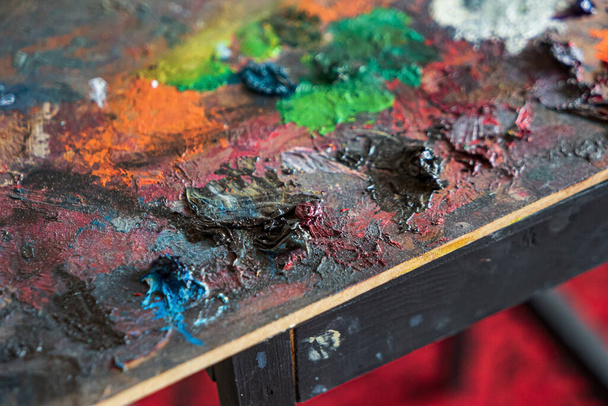 close up of art palette with colorful paint - Foto, Imagem
