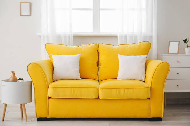 Stylish sofa near window in room - Foto, imagen