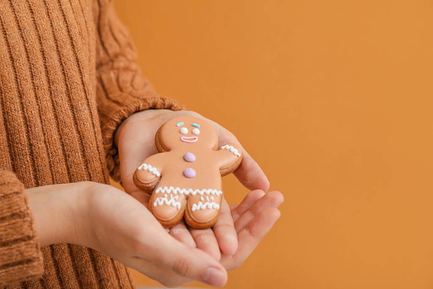 Woman holding Christmas cookie, closeup - Valokuva, kuva