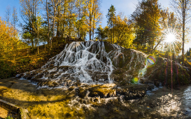 large waterfall and colorfu autumn forest panorama view - Fotoğraf, Görsel