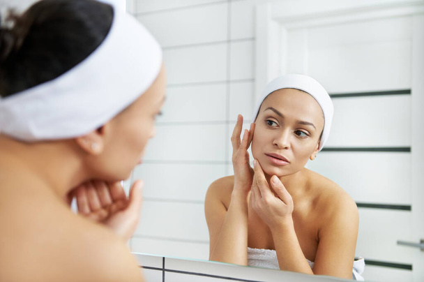 Portrait of beautiful healthy woman checking skin. Morning hydration spa beauty routine. - Φωτογραφία, εικόνα