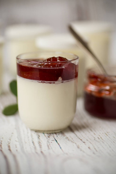 homemade sweet yogurt with fruit jam in a glass on the table - Fotoğraf, Görsel