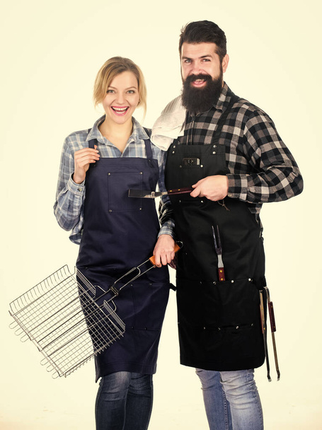 Man bearded hipster and girl ready for barbecue white background. Backyard barbecue party. Family bbq ideas. Couple in love getting ready for barbecue. Picnic and barbecue. Summertime leisure - Foto, Bild