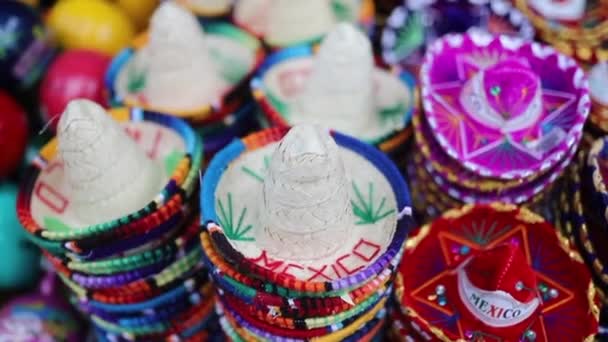 View Spinning Around Souvenirs in Form of Colorful Mexican Sombreros - Footage, Video