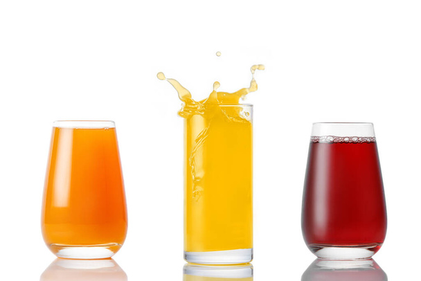 Set of glasses with different juices on a white background - Foto, immagini