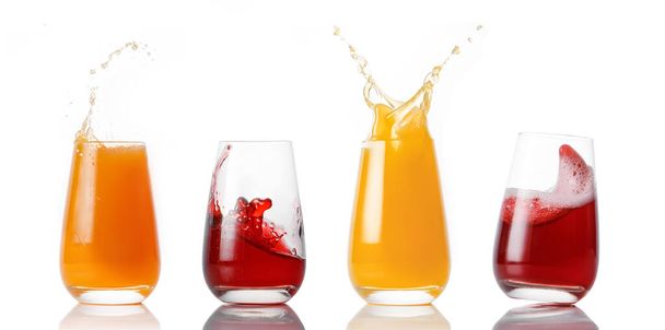 Set of glasses with different juices splashes on a white background - Photo, Image