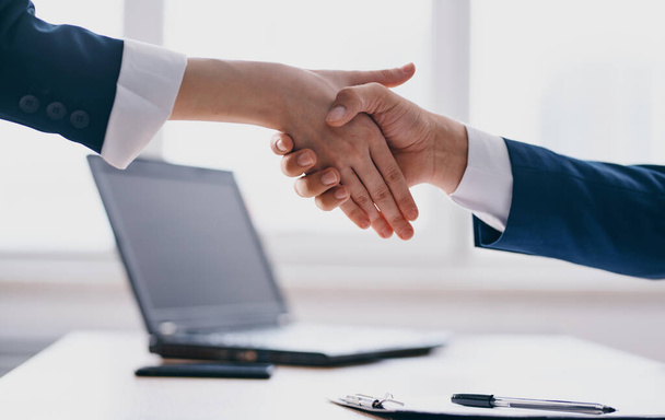 Gesturing hands handshake greeting business finance model - Foto, Bild