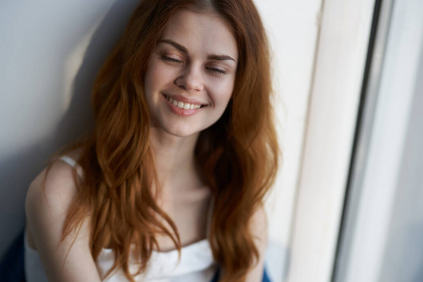 pretty smiling woman near window at home morning rest - Photo, Image