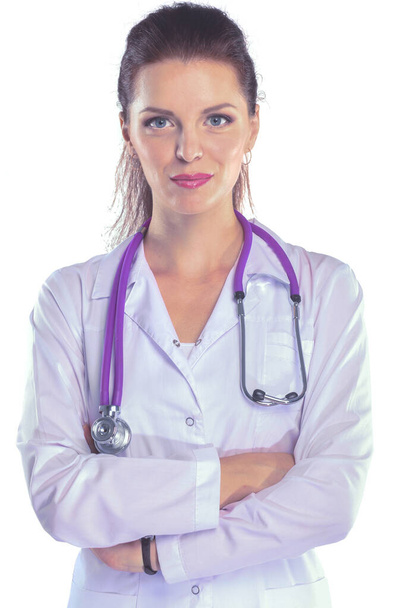 Portrait of young woman doctor with white coat standing in hospital . Portrait of young woman doctor - Photo, Image