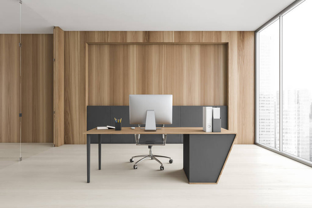 Interior of stylish CEO office with gray and wooden walls, wooden floor and wooden computer table. 3d rendering - Fotografie, Obrázek