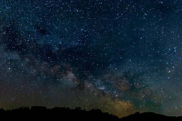 PAnoramic view of the Milky way over a mauntain range - Photo, image