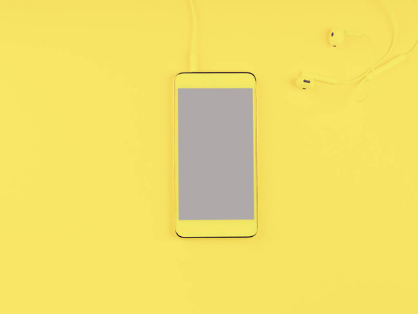 Smartphone with gray screen on illuminating yellow - Foto, afbeelding
