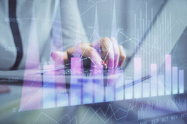 Double exposure of businesswoman hands typing on computer and financial graph hologram drawing. Stock market analysis concept. - Фото, изображение