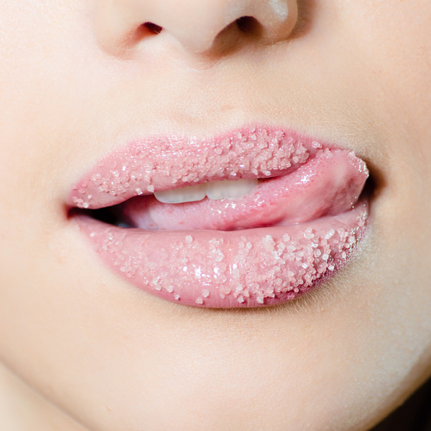 Woman licking lips in sugar - Фото, изображение