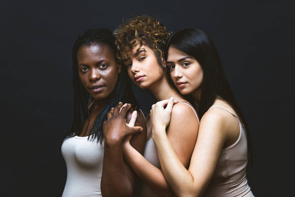 Multicultural group of beautiful women posing in underwear - 3 pretty girls portrait, concepts about multicultural people, inclusive society and body positivity - Photo, image