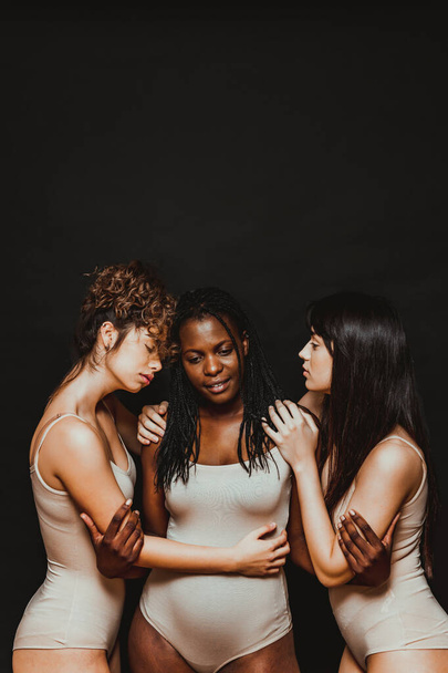 Multicultural group of beautiful women posing in underwear - 3 pretty girls portrait, concepts about multicultural people, inclusive society and body positivity - Foto, Imagen