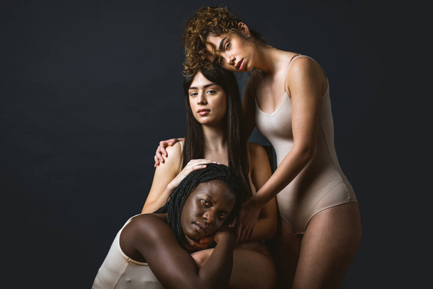 Multicultural group of beautiful women posing in underwear - 3 pretty girls portrait, concepts about multicultural people, inclusive society and body positivity - Zdjęcie, obraz