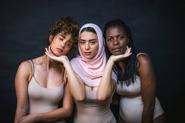 Multicultural group of beautiful women posing in underwear - 3 pretty girls portrait, concepts about multicultural people, inclusive society and body positivity - Foto, afbeelding