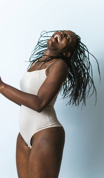 Beautiful woman posing in underwear - Pretty girl portrait, concepts about multicultural people, inclusive society and body positivity - 写真・画像