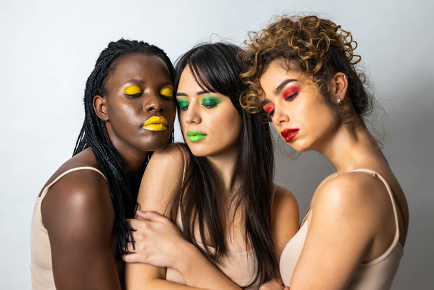 Multicultural group of beautiful women posing in underwear - 3 pretty girls portrait, concepts about multicultural people, inclusive society and body positivity - Foto, Imagen