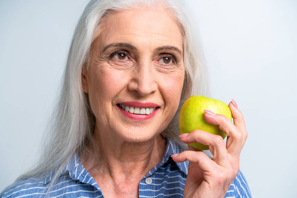 Beautiful senior woman portrait, studio shot on background  - Elderly person, half body shot - Photo, Image