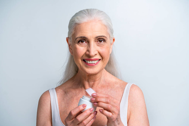 Beautiful senior woman portrait, studio shot on background  - Elderly person, half body shot - Fotó, kép