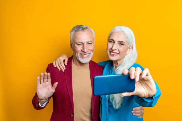 Beautiful senior couple of lovers  - Elderly people portrait on white background - Zdjęcie, obraz