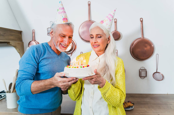 Beautiful senior couple of lovers  - Elderly people portrait while having fun at home - Concepts about relationship, elderly people and lifestyle - Foto, immagini
