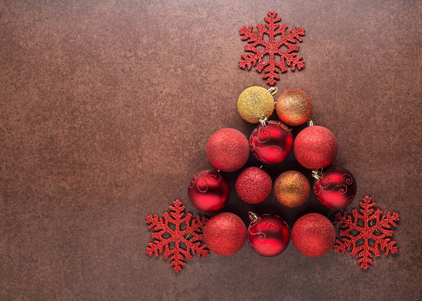 Christmas background with decorations objects in the shape of a Christmas tree. Christmas, winter, new year concept. - Foto, Bild