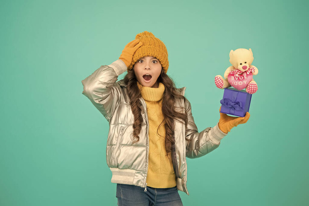 great surprise. happy new year. gift for winter holiday. stylish kid in warm winter clothes. shopping online with extra bonus. small girl surprised about xmas present. gift with love. merry christmas - 写真・画像