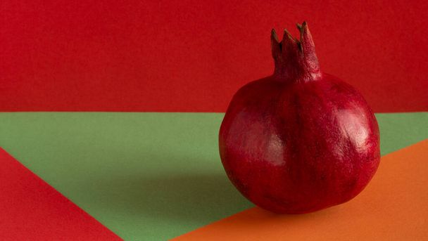 Pomegranate, a pomegranate fruit isolated on a white , red, green, or orange background. Fresh fruit. - Photo, Image