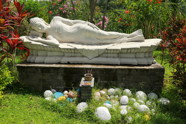 Statue of Sleeping Buddha at Vihara Dharma Giri, Buddhist temple in the village of Pupuan in Tabanan, West Bali, Indonesia. - Photo, Image