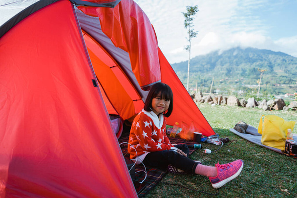 Portrait little girl enjoying camping - Фото, изображение