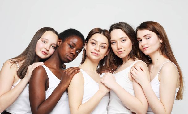 lifestyle, friendship and people concept - group of five girls friends of different nationalities - 写真・画像