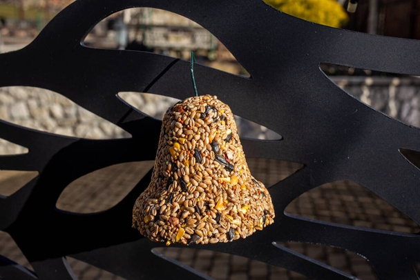 Bell from various grains, a delicacy for all the birds in the garden - Photo, Image