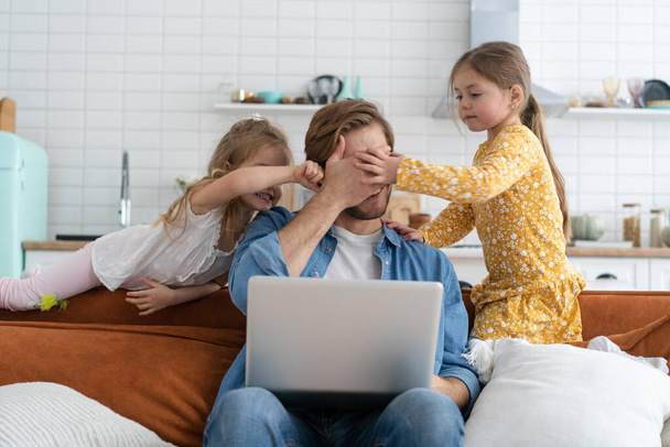 Father working from home with children. Homeschooling, stay home, social distancing during coronavirus quarantine - Photo, Image