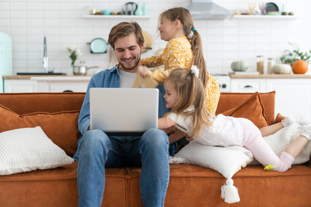 Father working from home with children. Homeschooling, stay home, social distancing during coronavirus quarantine - Foto, Imagem