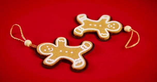toy gingerbread ornament on Christmas red background - Footage, Video