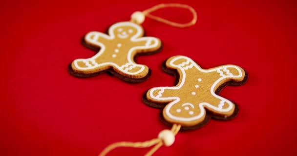 toy gingerbread ornament on Christmas red background - Footage, Video