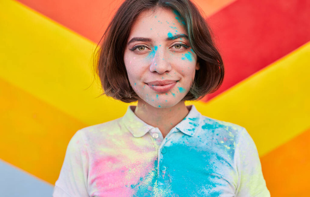Modern woman with dry pigment paints on face - Photo, image