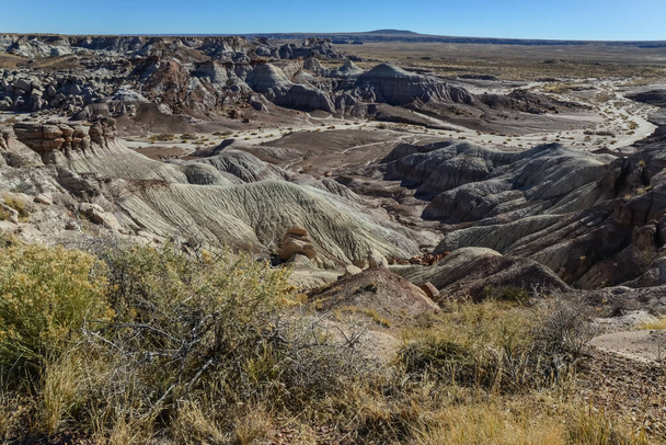 The Painted Desert on a sunny day. Diverse sedimentary rocks and clay washed out by water. Petrified Forest National Park, USA,  Arizona - Φωτογραφία, εικόνα