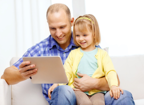 Happy father and daughter with tablet pc computer - Фото, изображение